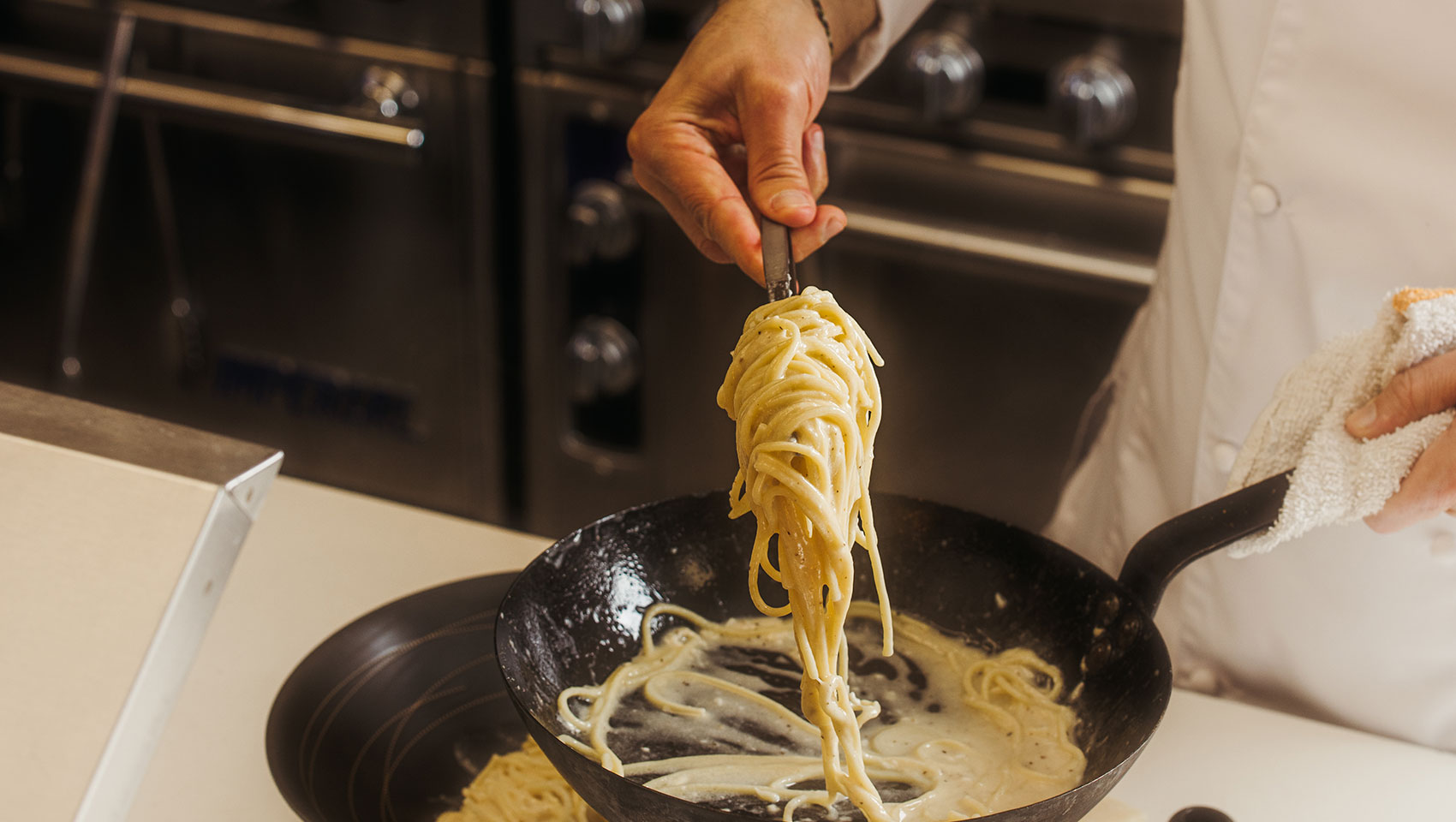 chef cooking pasta at Cavalier San Antonio 2
