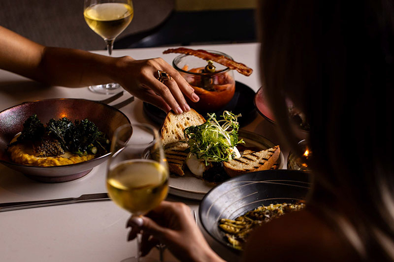 friends enjoying meal at cavalier​